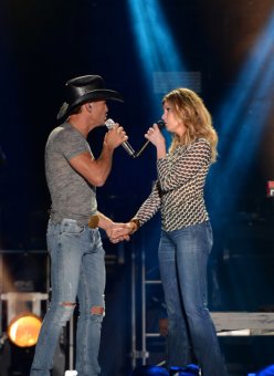 NASHVILLE, TN - JUNE 05: Tim McGraw and wife Faith Hill perform onstage during the 2014 CMA Festival at LP Field on June 5, 2014 in Nashville, Tennessee. (picture by C Flanigan/FilmMagic)